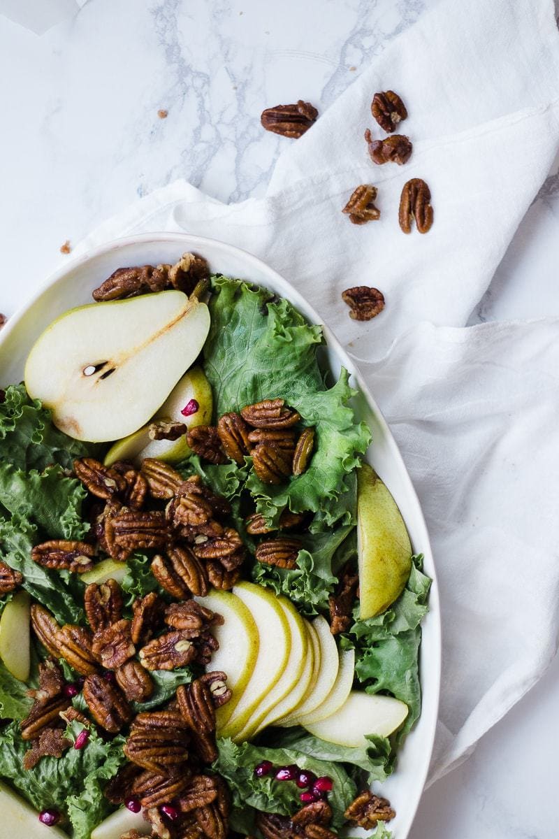 candied pecans atop pear salad