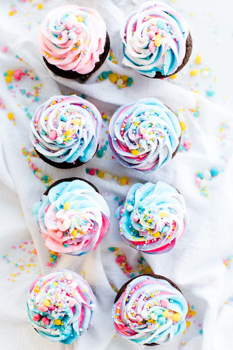 chocolate cupcakes with colorful frosting and sprinkles