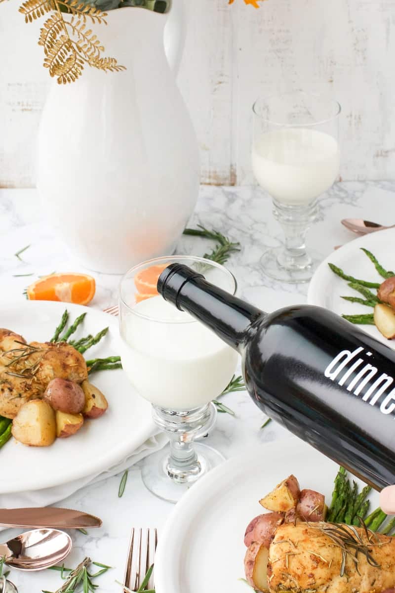 Rosemary Chicken and Potatoes next to milk being poured in glass