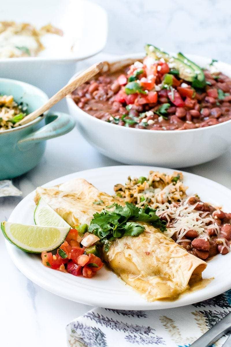 Mexican Green Enchiladas served with beans and pico de gallo