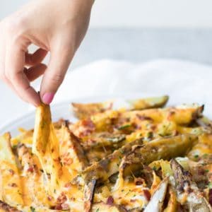 cheesy potato fries - Cheesy Potato Wedges by popular Los Angeles foodie blog Oh So Delicioso