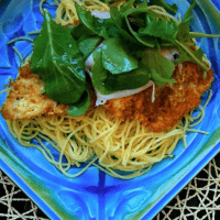 Chicken Bellagio on a blue plate