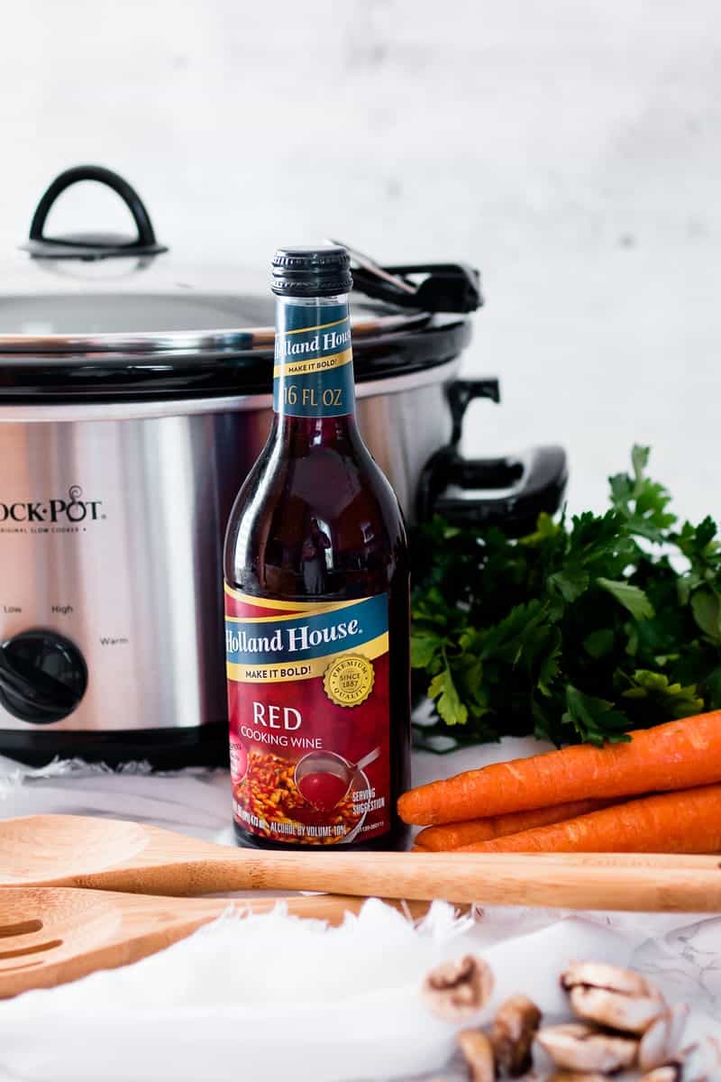 Holland house red cooking wine next to crock pot
