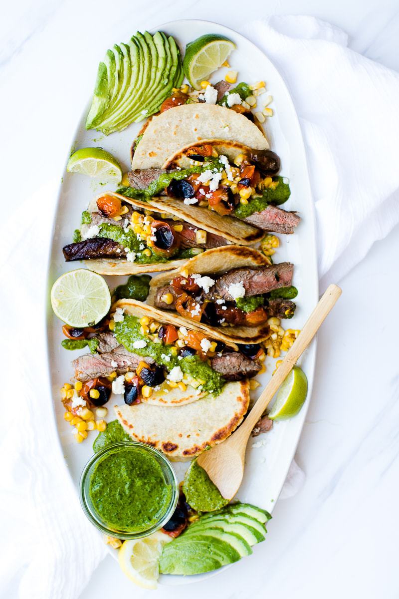Chimichurri Steak Tacos on a large oval serving plate