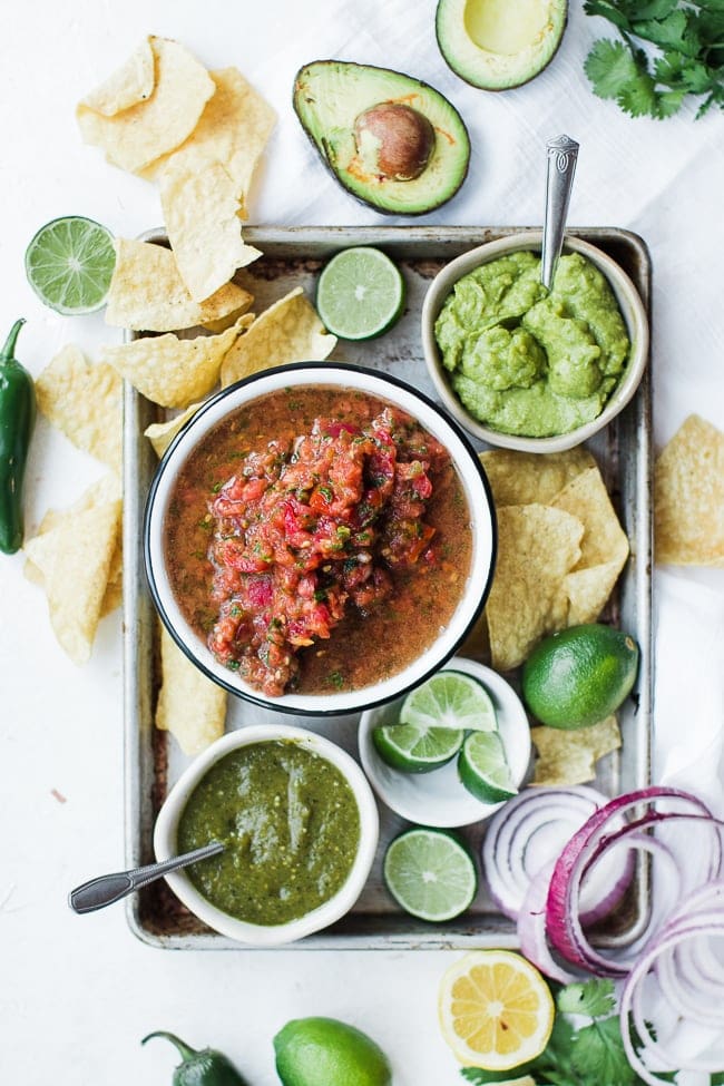 fresh salsa, chips and guac on a tray