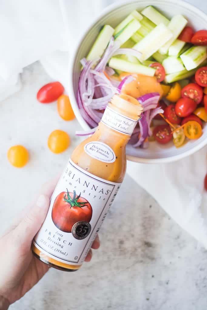 chopped veggies with Brianna's brand dressing bottle