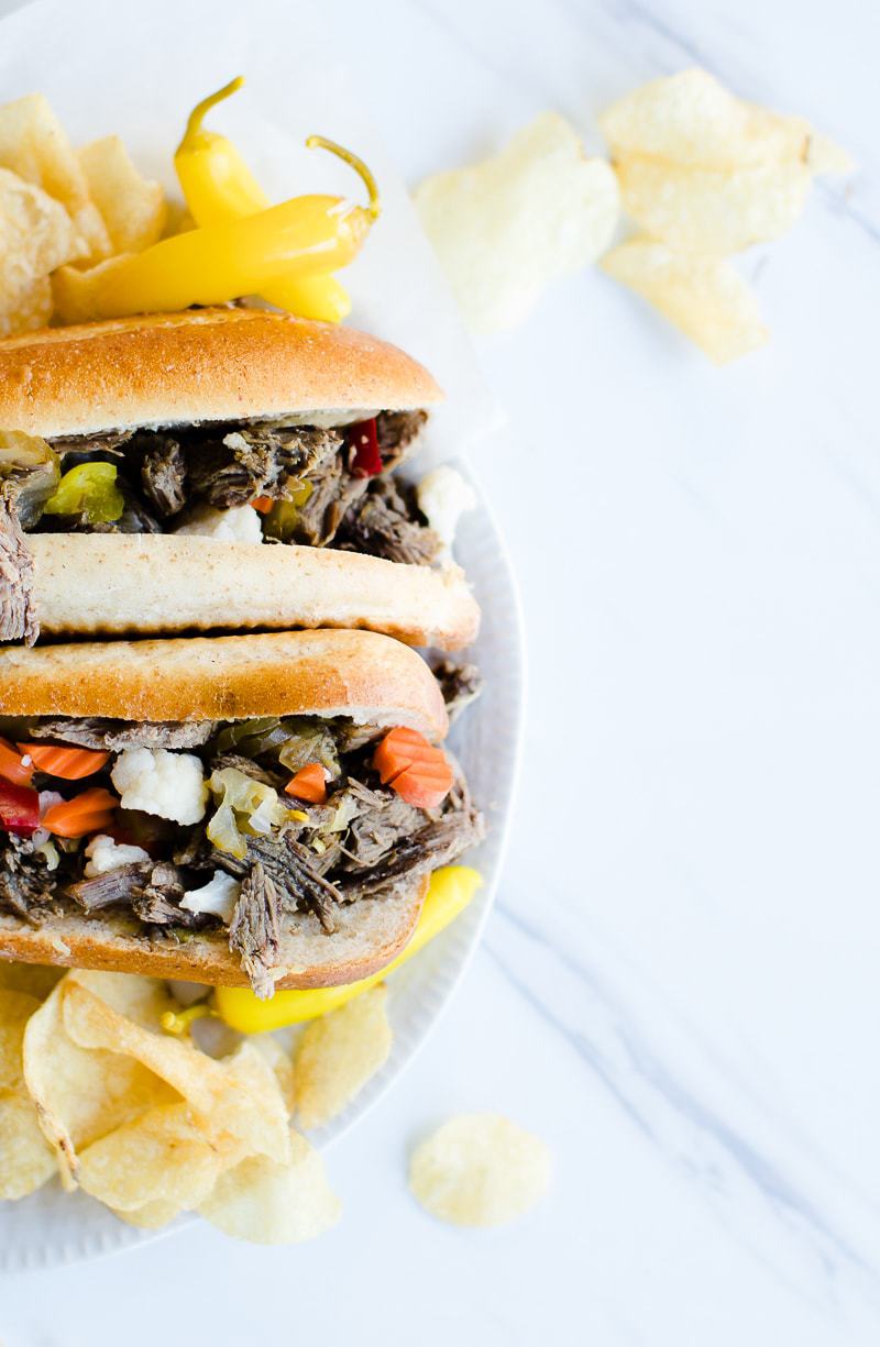 Instant Pot Italian Beef Sandwiches on plate with peppers and chips