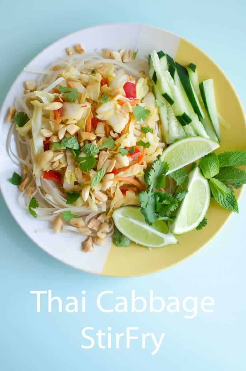A close up of thai cabbage stir fry on a white and yellow plate