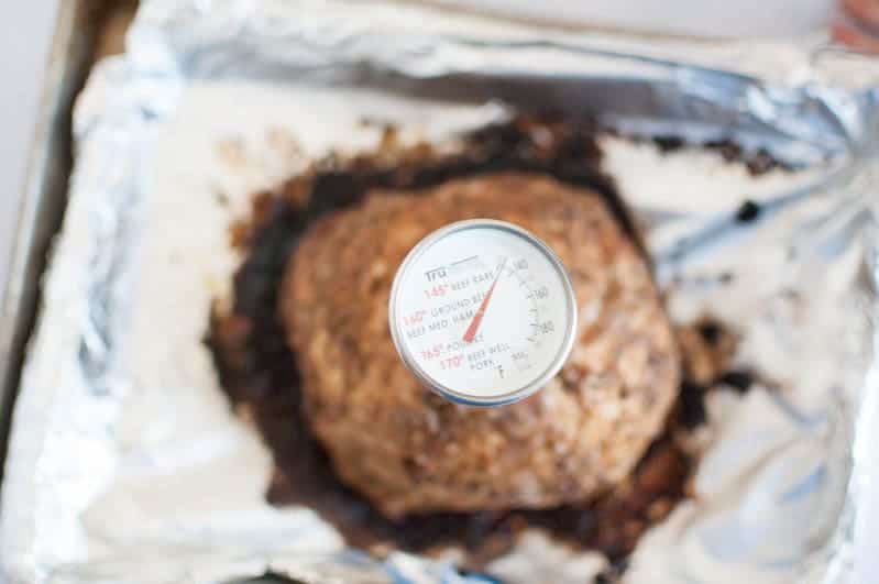 herb pork with thermometer in it