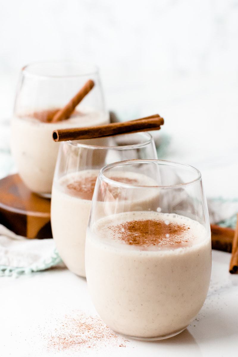 Snickerdoodle Protein Shake in 3 glasses with cinnamon on top