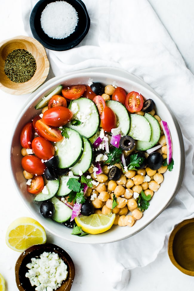Chickpea salad with tomatoes, cucumbers, olives, purple onions