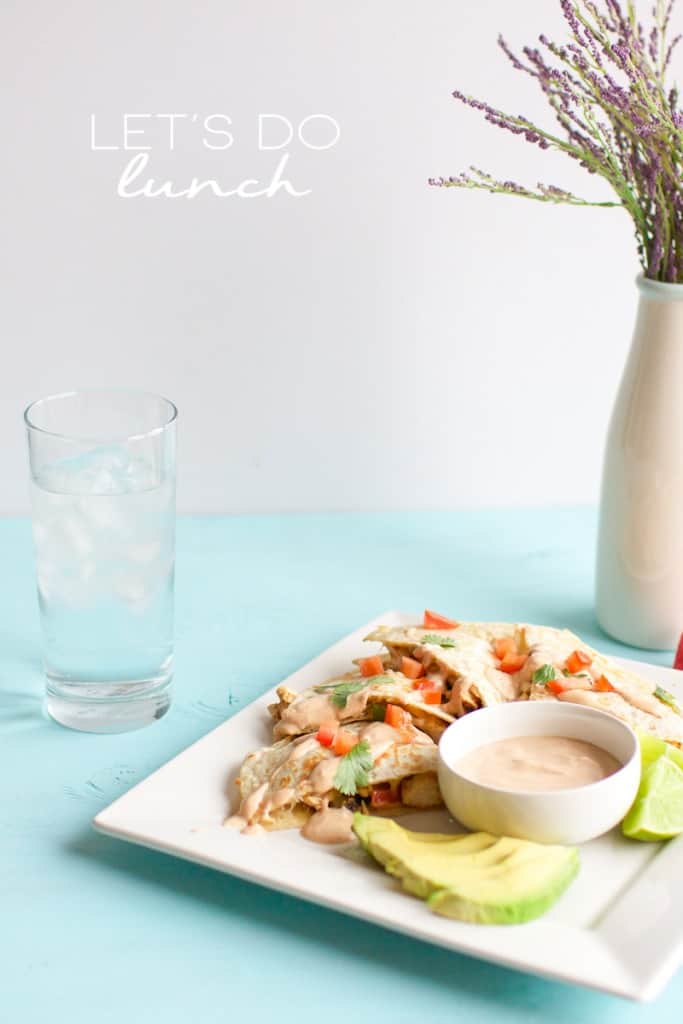 Chipotle Chicken Quesadilla on plate with avocado and words that read, "Let's do lunch"