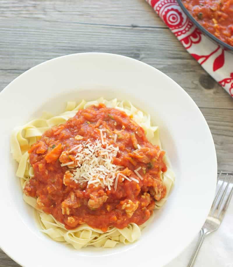 Hearty Pasta Sauce with Homemade Noodles in bowl topped with parmesan cheese