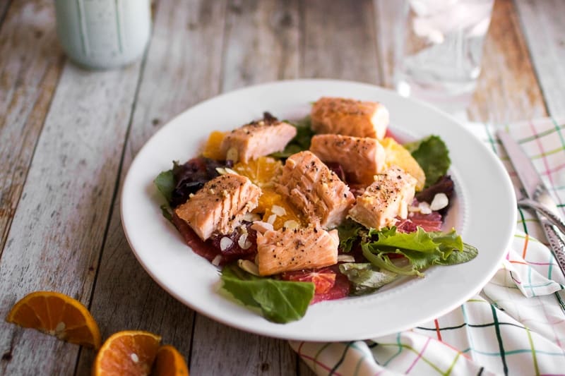 Citrus and Salmon Salad on white plate 