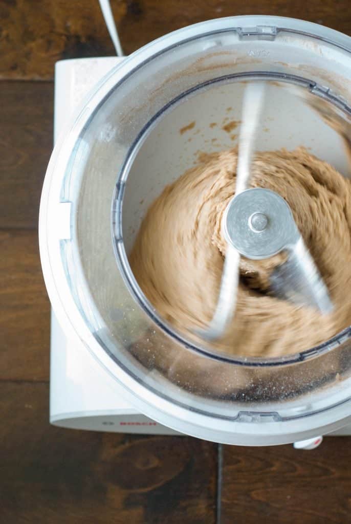 An overhead shot of 100% Whole Wheat Bread dough in a mixer
