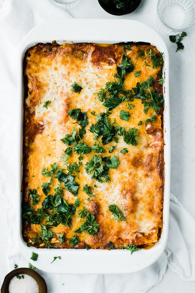9x13 pan of lasagna with parsley topped