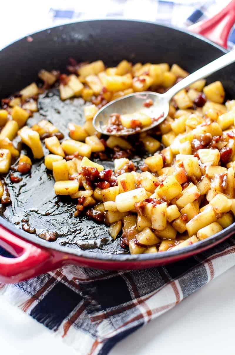 A close up of Sautéed Apples with Bacon in a skillet