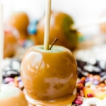 caramel apple surrounded by candy