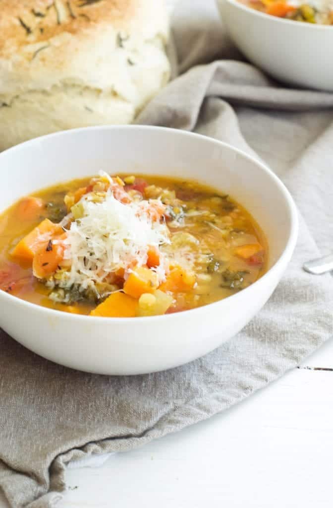 Lentil and Farro Vegetable Soup in white bowl 