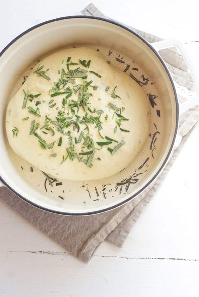 An overhead shot of Quick Crusty Herb Bread dough in a bowl