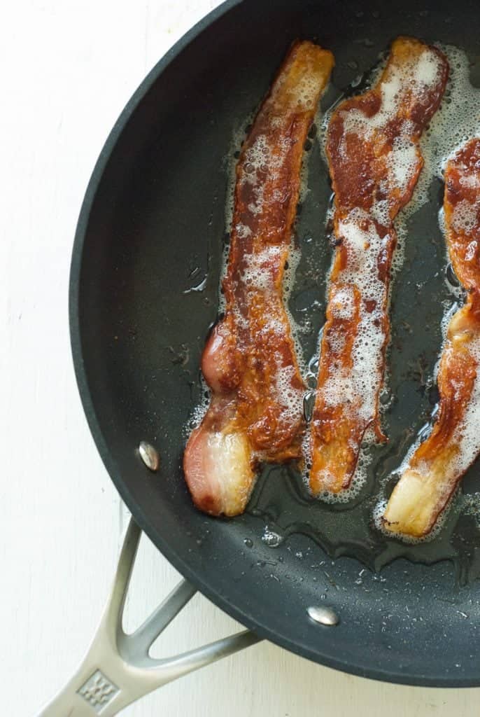 bacon frying on pan 