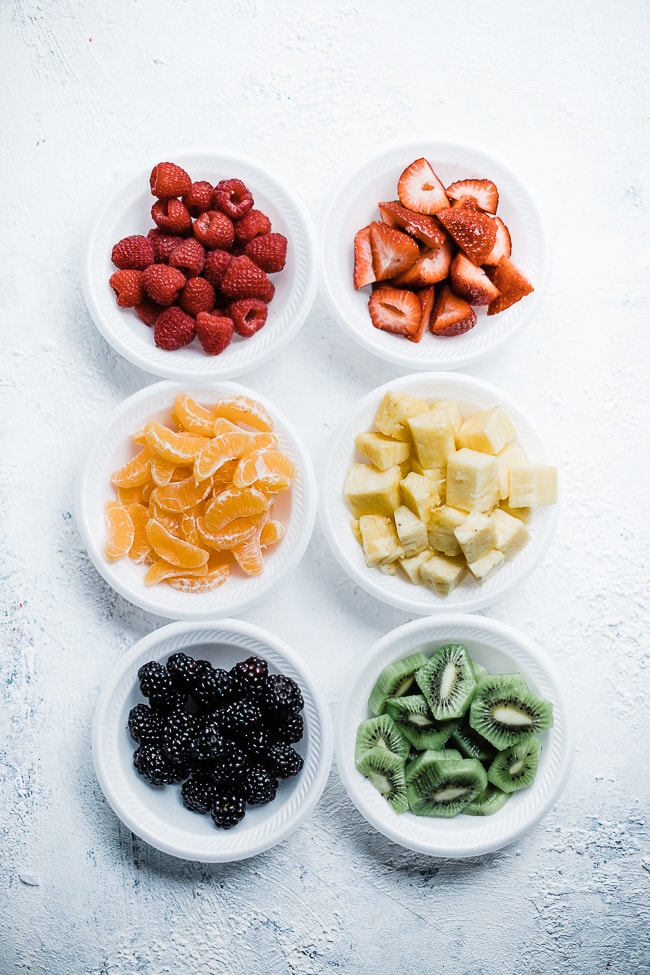 Mojito fruit salad ingredients - fruit separated. 