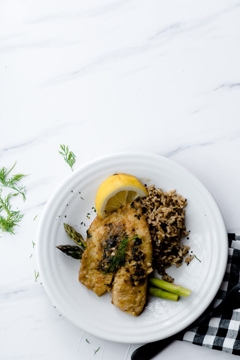 lemon herb tilapia served with brown rice and asparagus