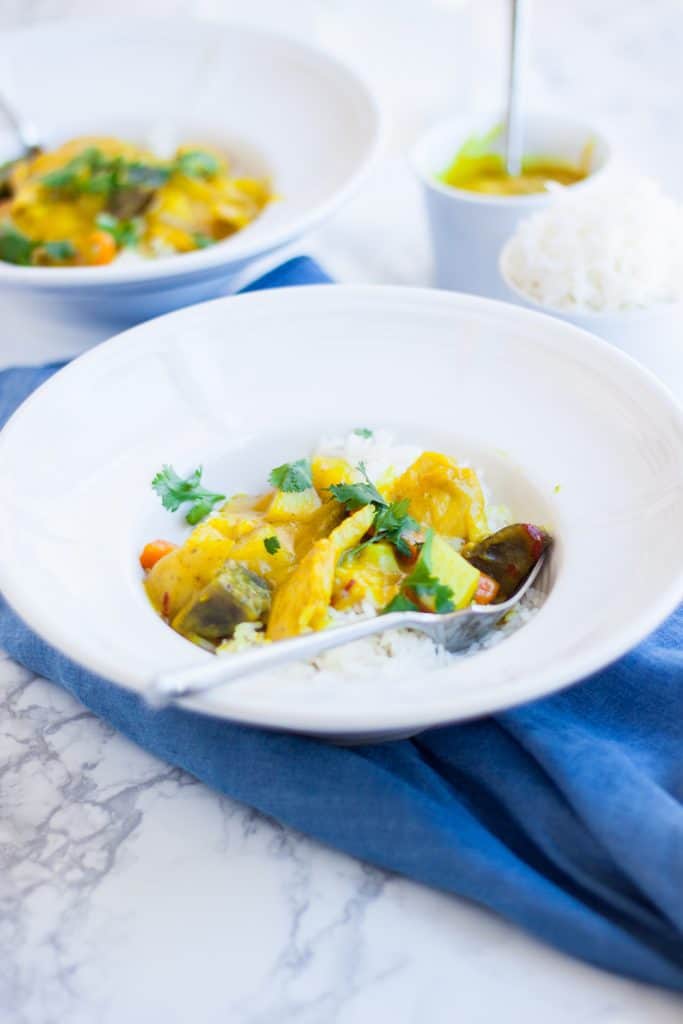 Thai Yellow Coconut Curry in bowl over jasmine rice