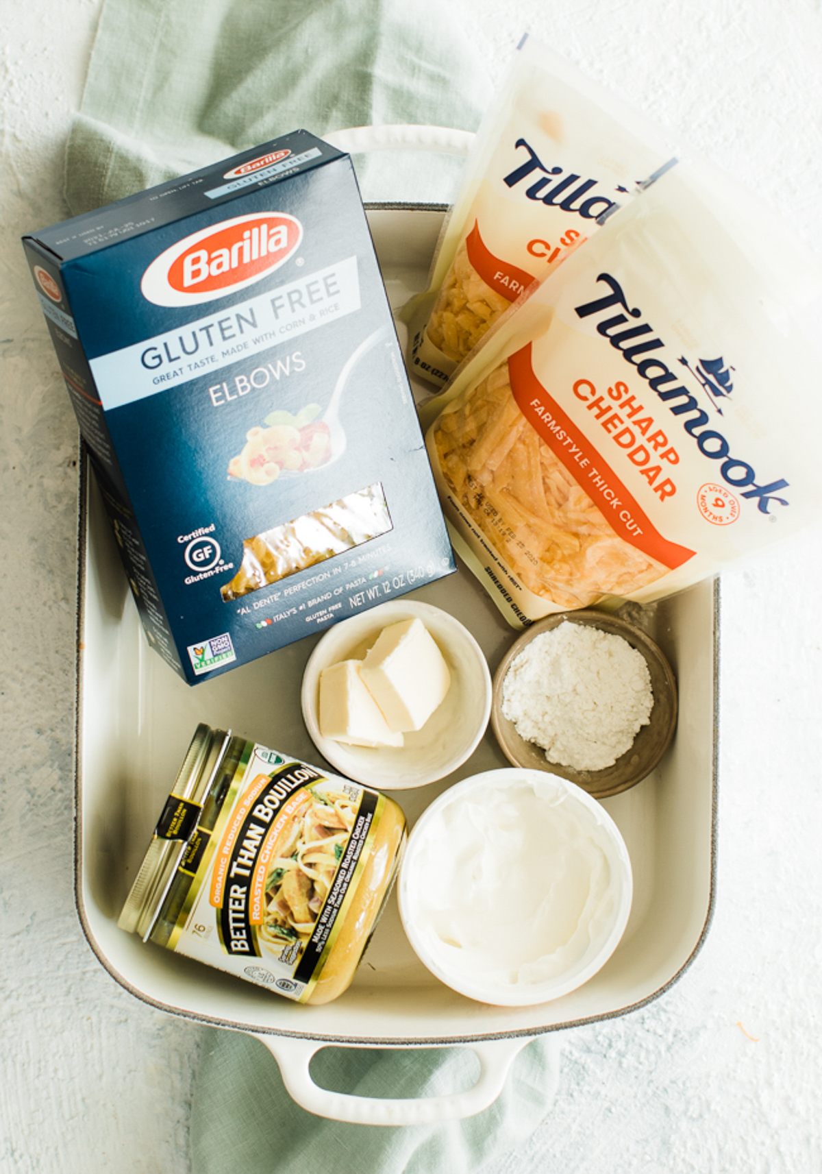 pasta, cheese and broth plus other ingredients for creamy mac and cheese recipe