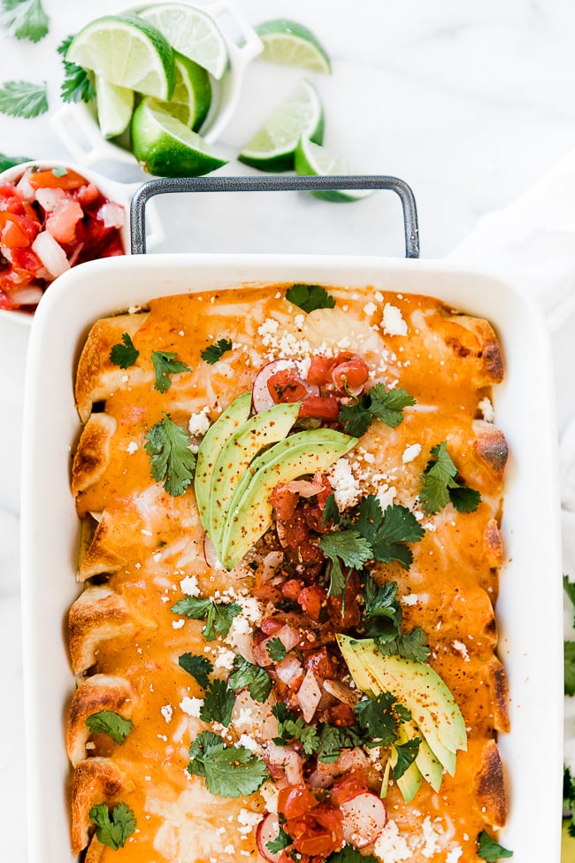 A pan of roasted red pepper enchiladas.