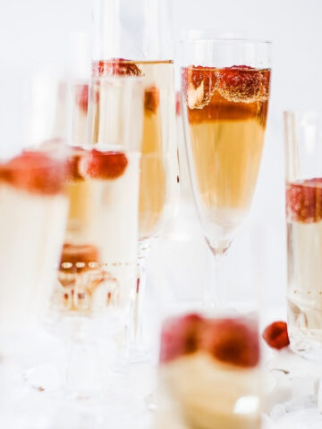Mock champagne poured up In glass flutes.