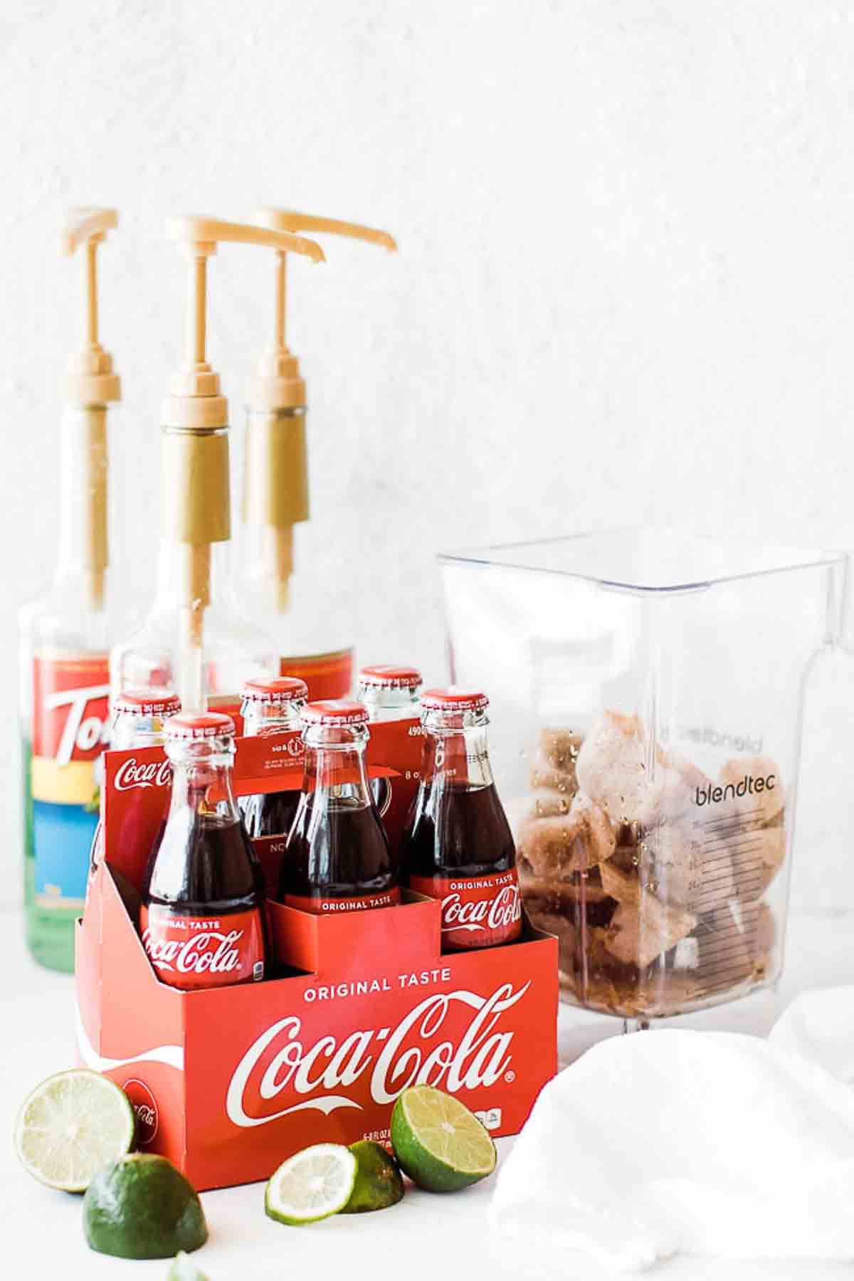 Ingredients to make frozen coke on the table.