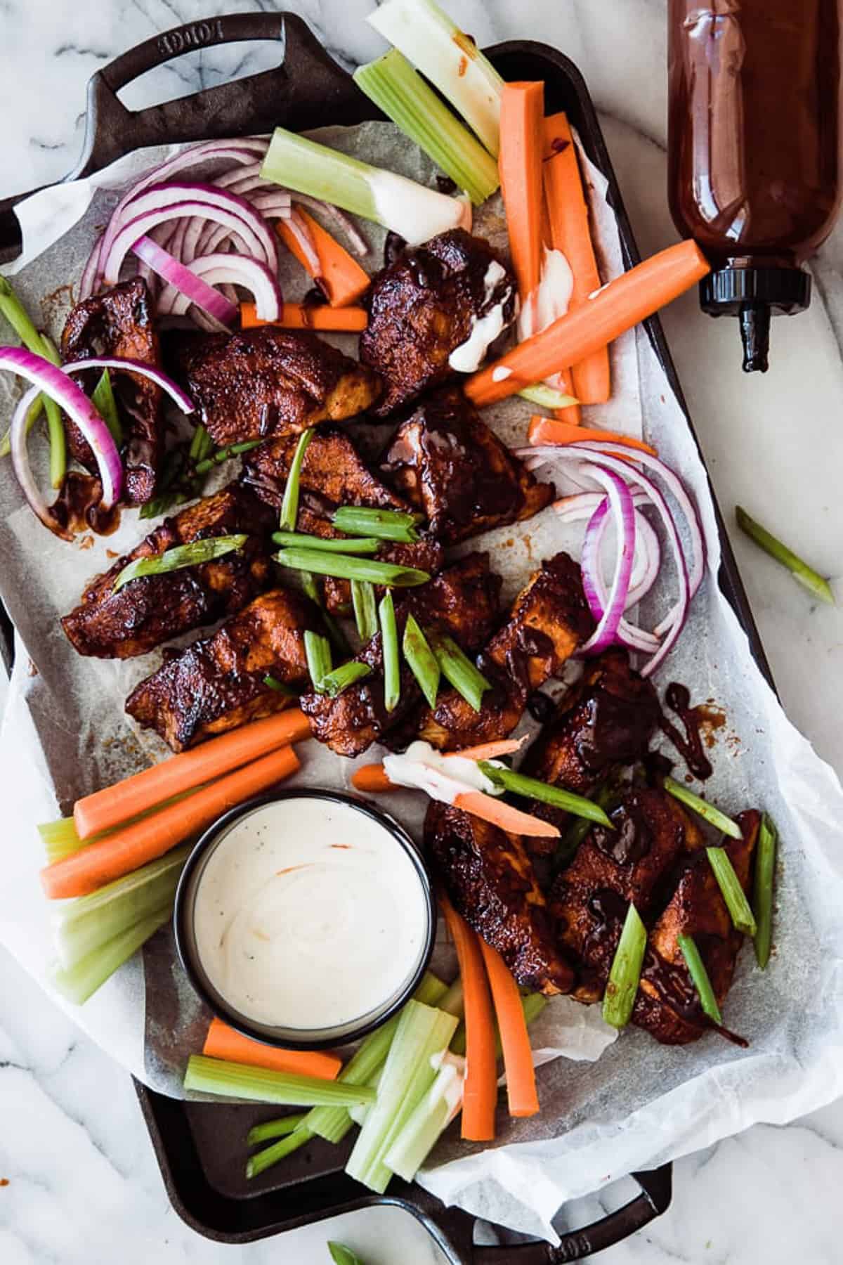 platter of ribs with ranch dipping sauce