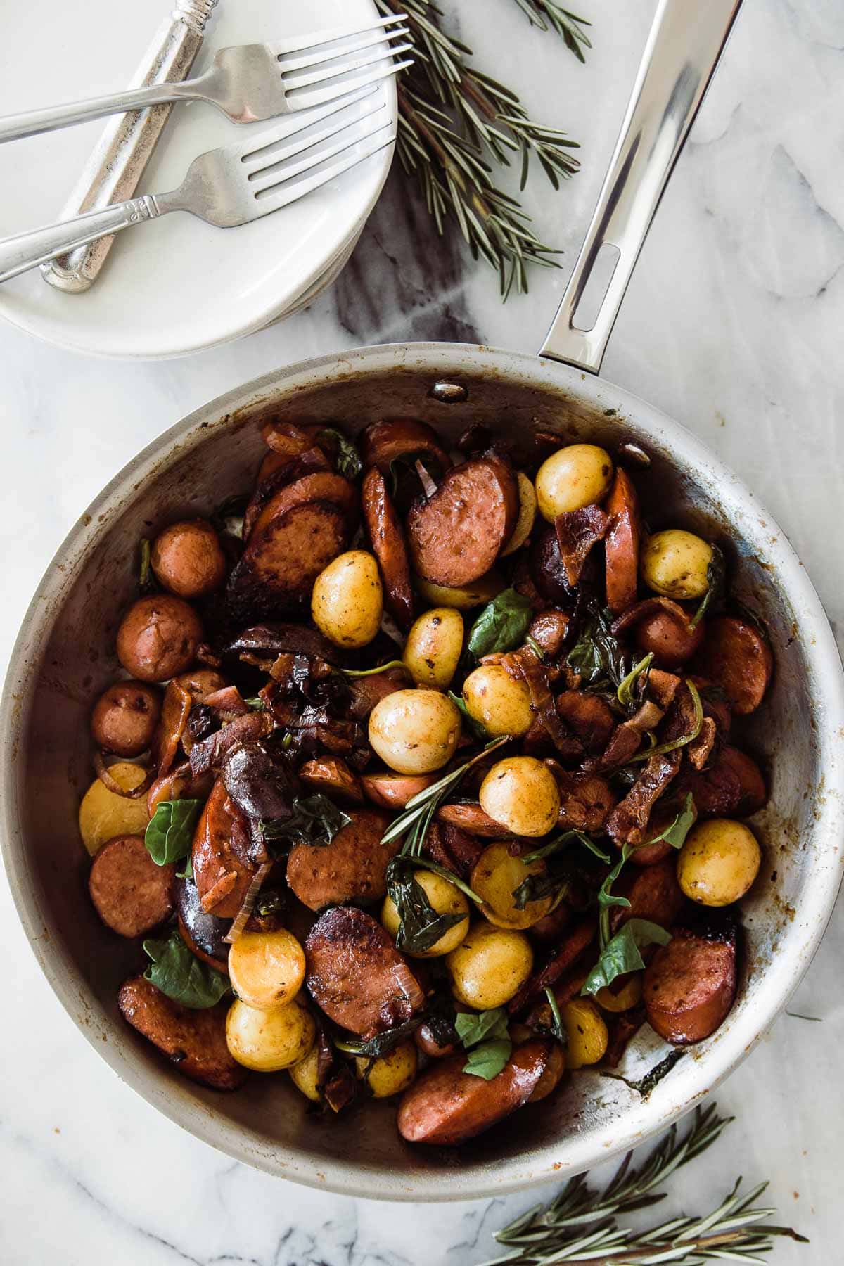 Potatoes and kielbasa recipe cooked and served up in a large skillet