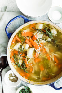 chicken and dumping, carrots and celery in large pot