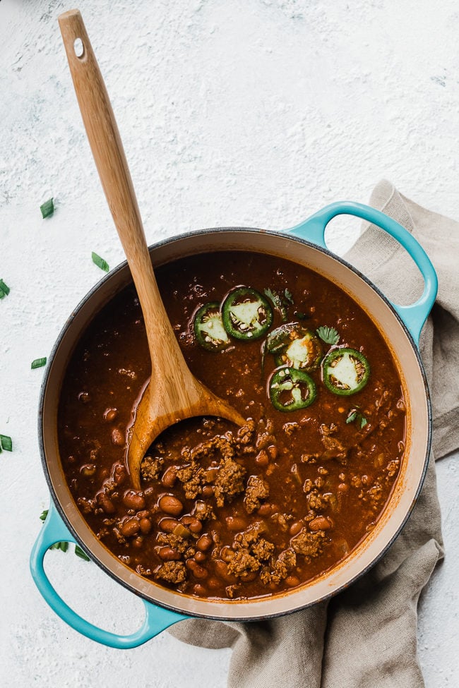Best Chili Con Carne in a turquoise dutch oven.