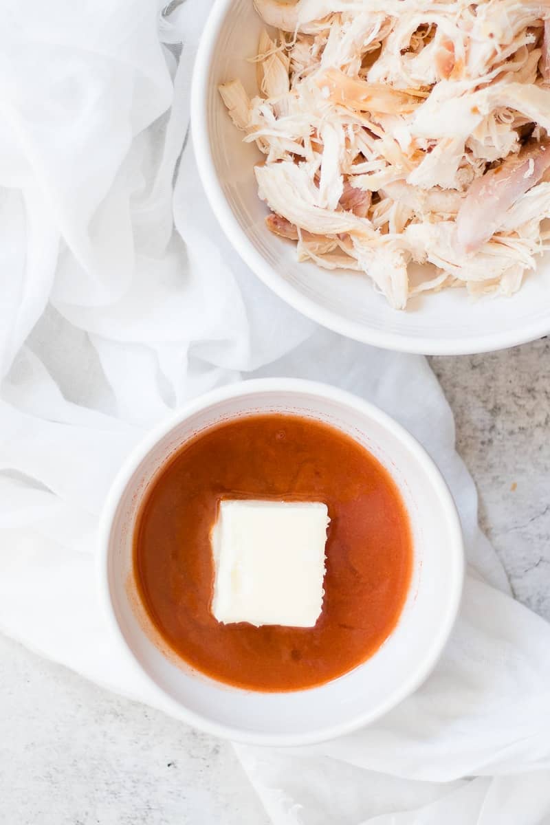 Buffalo Chicken sauce with blue cheese dressing in a bowl