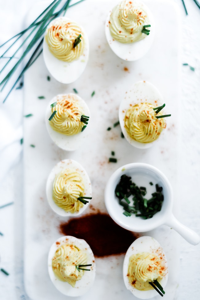 The best deviled eggs on a marble platter.
