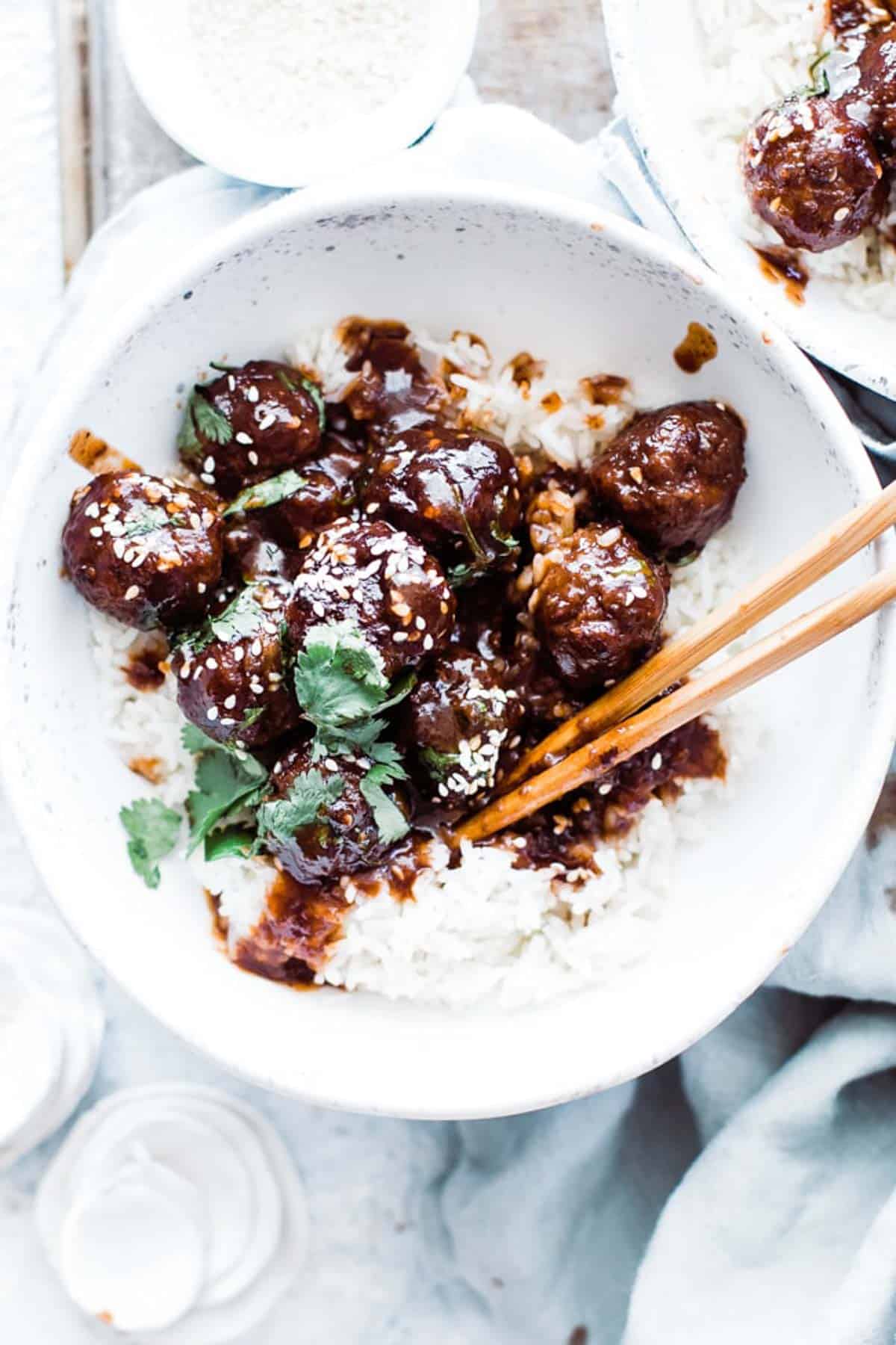 One bowl of easy sweet and sour meatball with chopsticks.