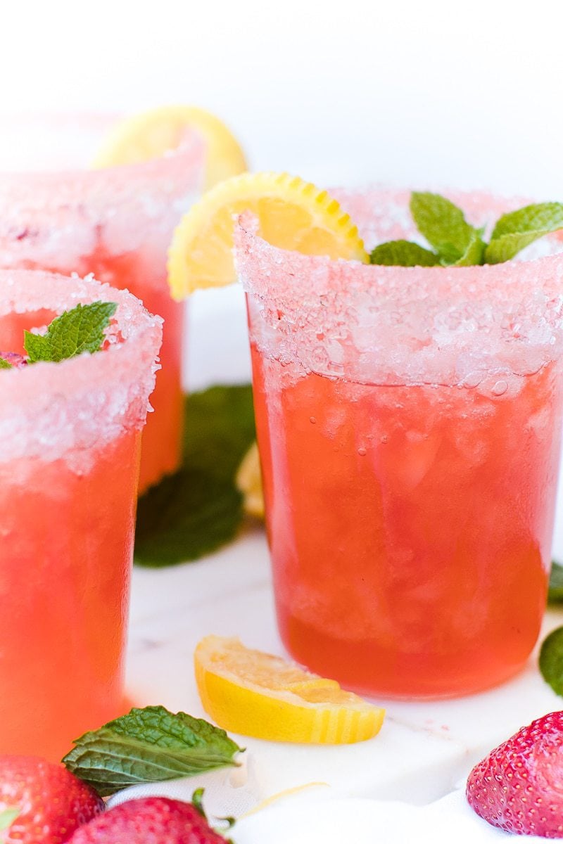 A close up of a glass of homemade strawberry lemonade