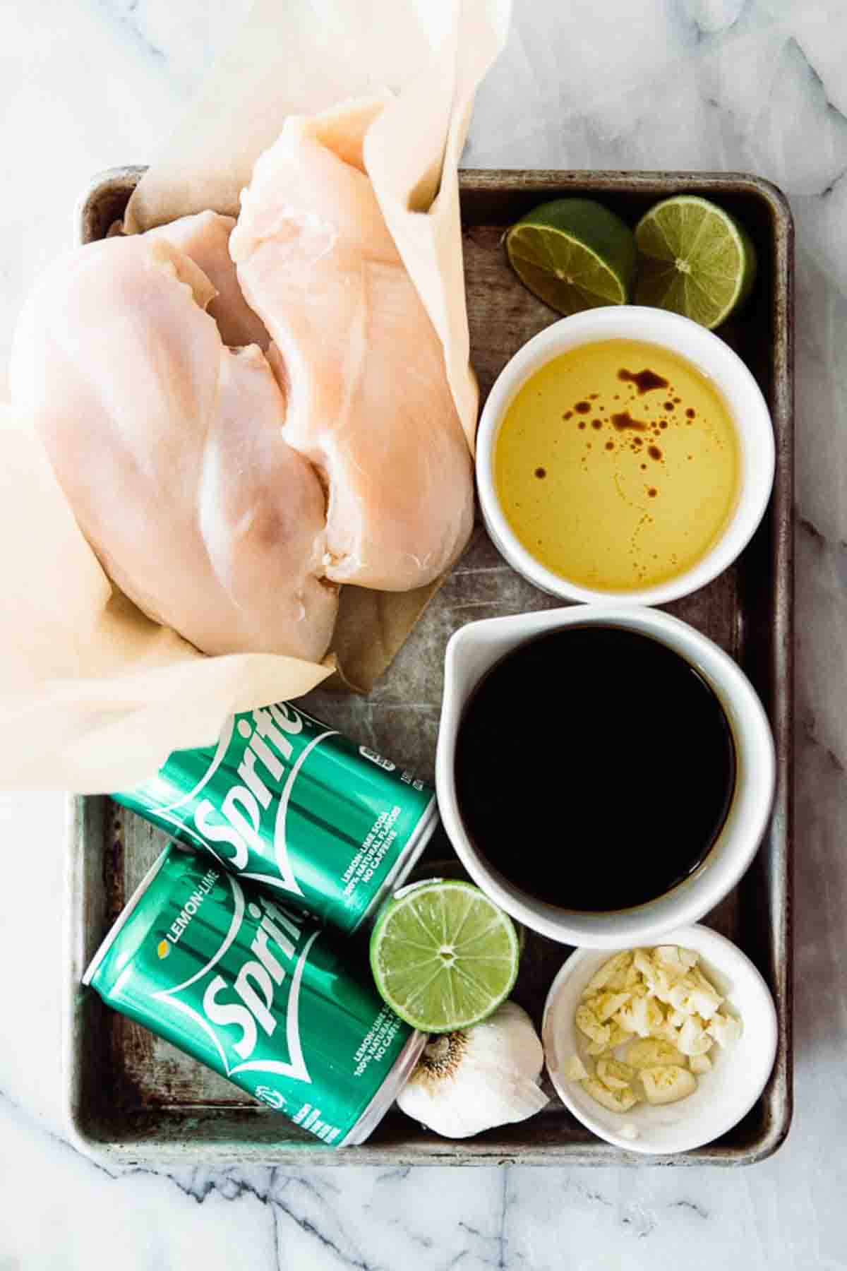 Ingredients to make lime chicken marinade on a tray.