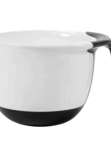 white batter bowl with black silicone handle and bottom