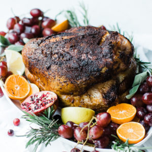 smoked turkey breast with fruit grapes and herbs for garnish