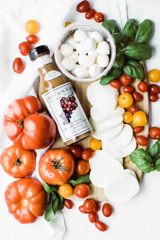 heirloom tomatoes, fresh mozzarella and basil with a bottle of balsamic dressing