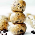 A stack of three protein balls for kids on the table with chocolate chips.