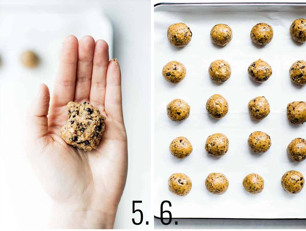 A hand holding a scoop of peanut butter oatmeal balls to shape and then laid out on a baking sheet.