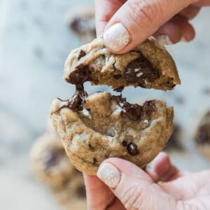 A browned butter chocolate chip being pulled apart.