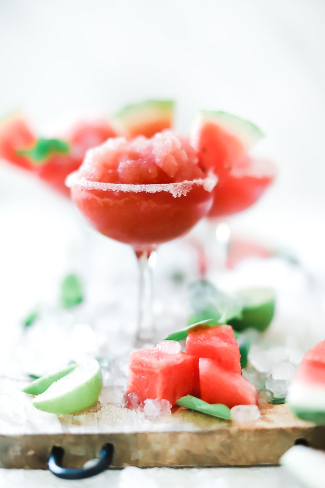 Close up of watermelon slush in a stemmed glass.