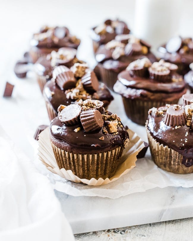 A closeup of chocolate peanut butter cupcakes.