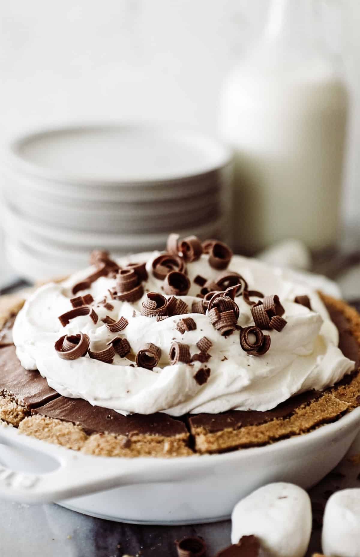 S'mores chocolate pie with whipped cream and chocolate shavings on top.